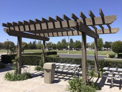 This is an image of a pergola constructed in a large complex.